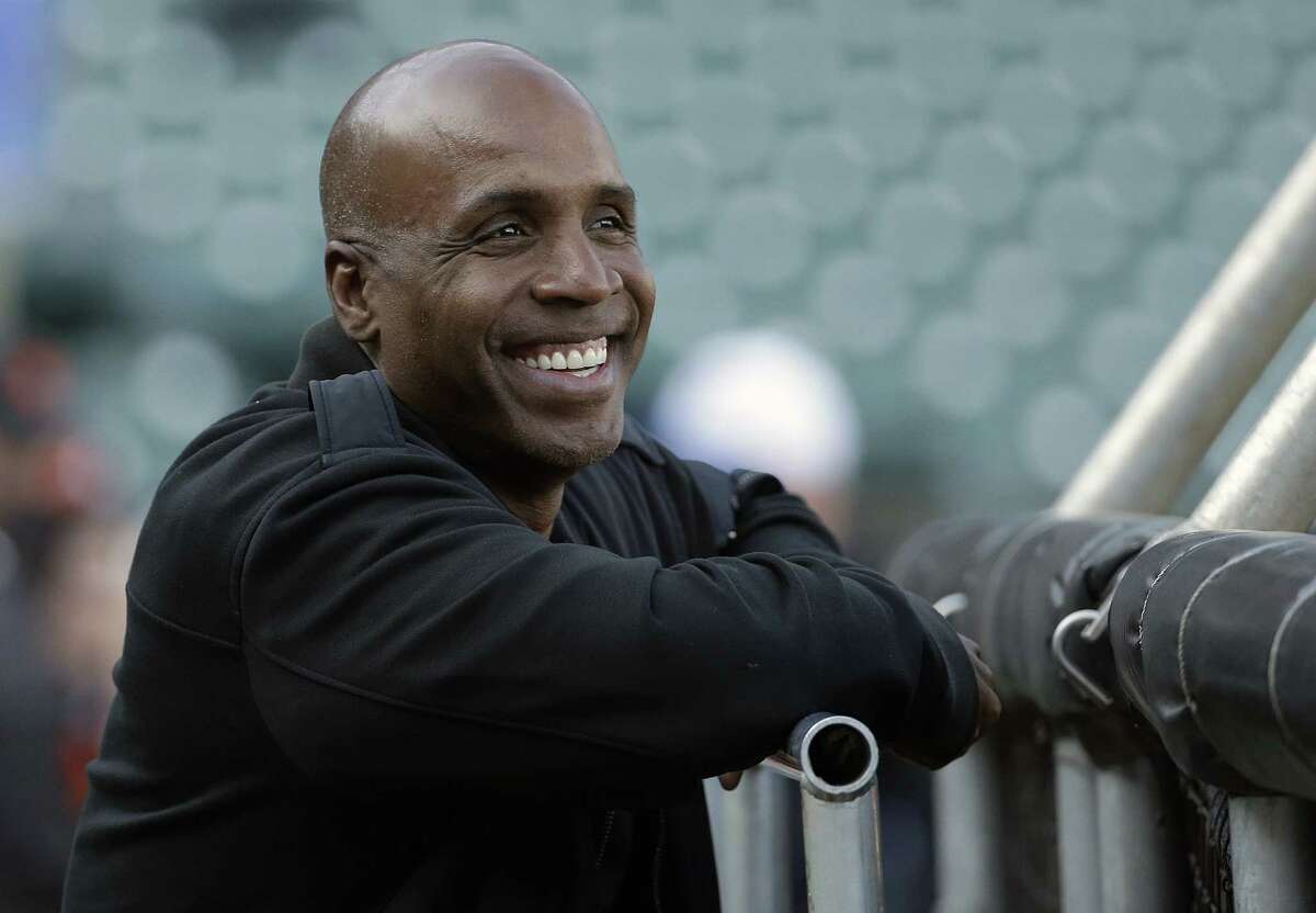 FILE - In this Aug. 25, 2015, file photo, former baseball player Barry Bonds smiles before a baseball game between the San Francisco Giants and the Chicago Cubs in San Francisco. Bonds is back in the major leagues as hitting coach for the Miami Marlins.