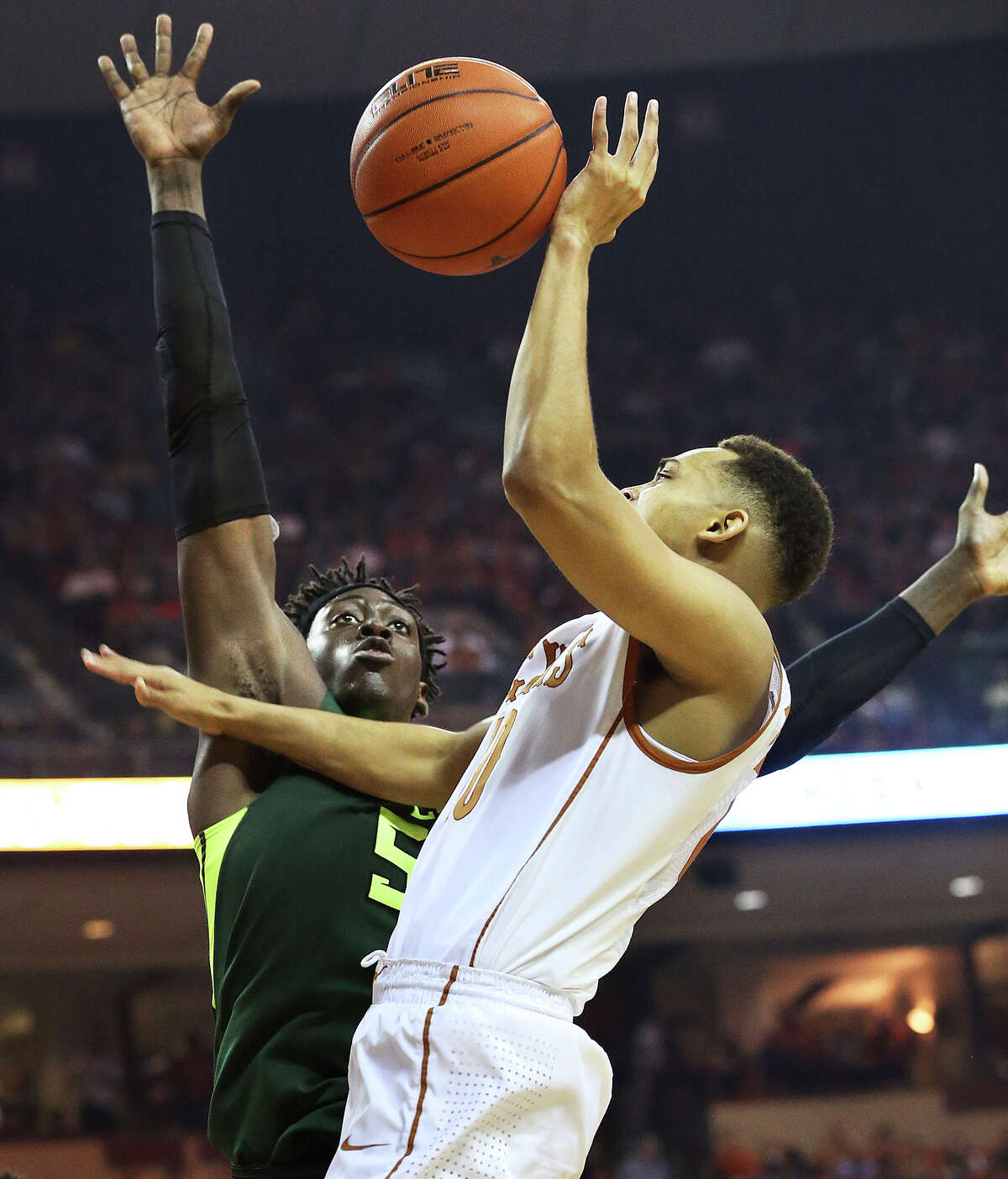 Eric Davis loses control under a block threat from Bear forward Johnathan Motley as UT hosts Baylor in men's basketball at the Erwin Center on February 20, 2016.