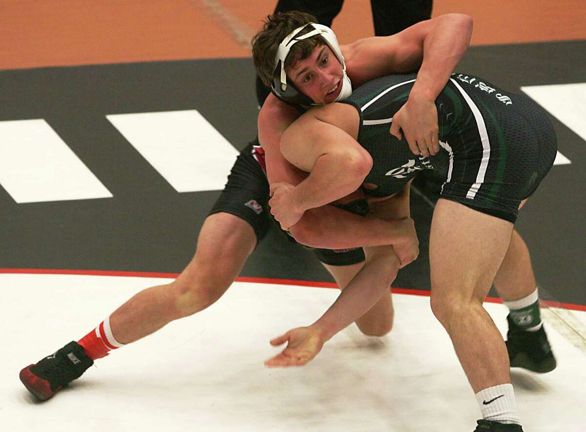 Churchill’s Tim Edmonson (left) finished third at 138 pounds and compiled a 32-1 record.