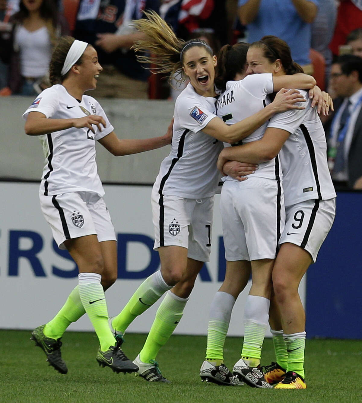 U.S. Lindsey Horan, right, celebrates her goal with Mallory Pugh, left, Morgan Brian, Kelly O'Hara, during the second half of game against Canada during the CONCACAF Olympic women's soccer qualifying championship final at BBVA Compass Stadium Sunday, Feb. 21, 2016, in Houston.