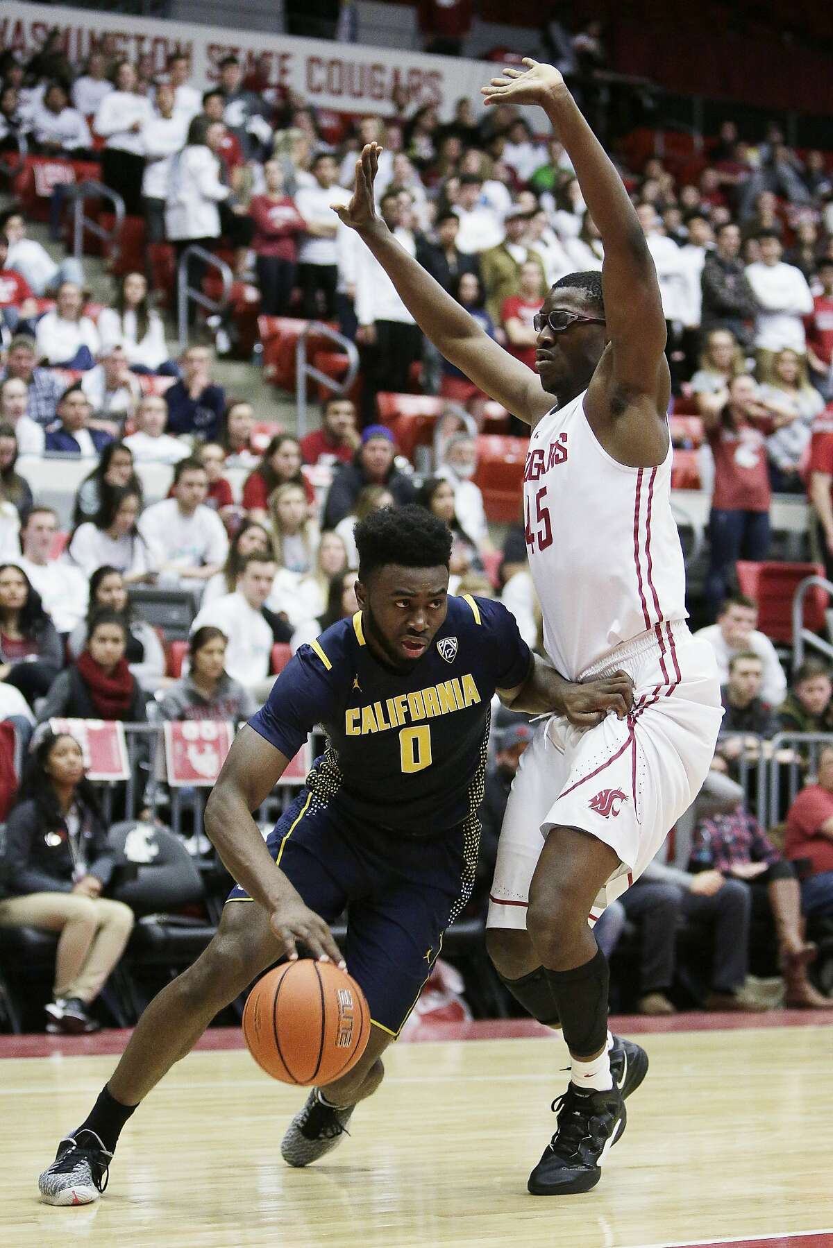 California's Jaylen Brown (0) drives against Washington State's Valentine Izundu (45) during the first half of an NCAA college basketball game, Sunday, Feb. 21, 2016, in Pullman, Wash.