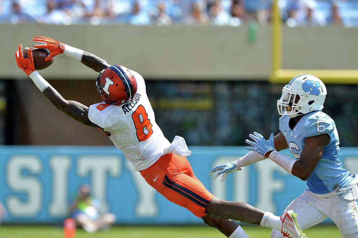 CHAPEL HILL, NC - SEPTEMBER 19: Geronimo Allison #8 of the Illinois Fighting Illini makes as leaping catch as M.J. Stewart #6 of the North Carolina Tar Heels defends during their game at Kenan Stadium on September 19, 2015 in Chapel Hill, North Carolina.