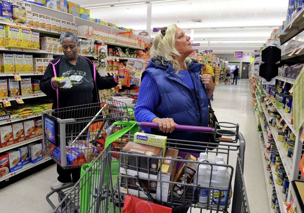 Danbury residents Flora Franchville, left, and Carol Levine buy groceries at Stop & Shop on Lake Avenue in November 2014. Stop & Shop is preparing for a potential work stoppage by advertising for temporary workers at stores in Fairfield County and elsewhere.