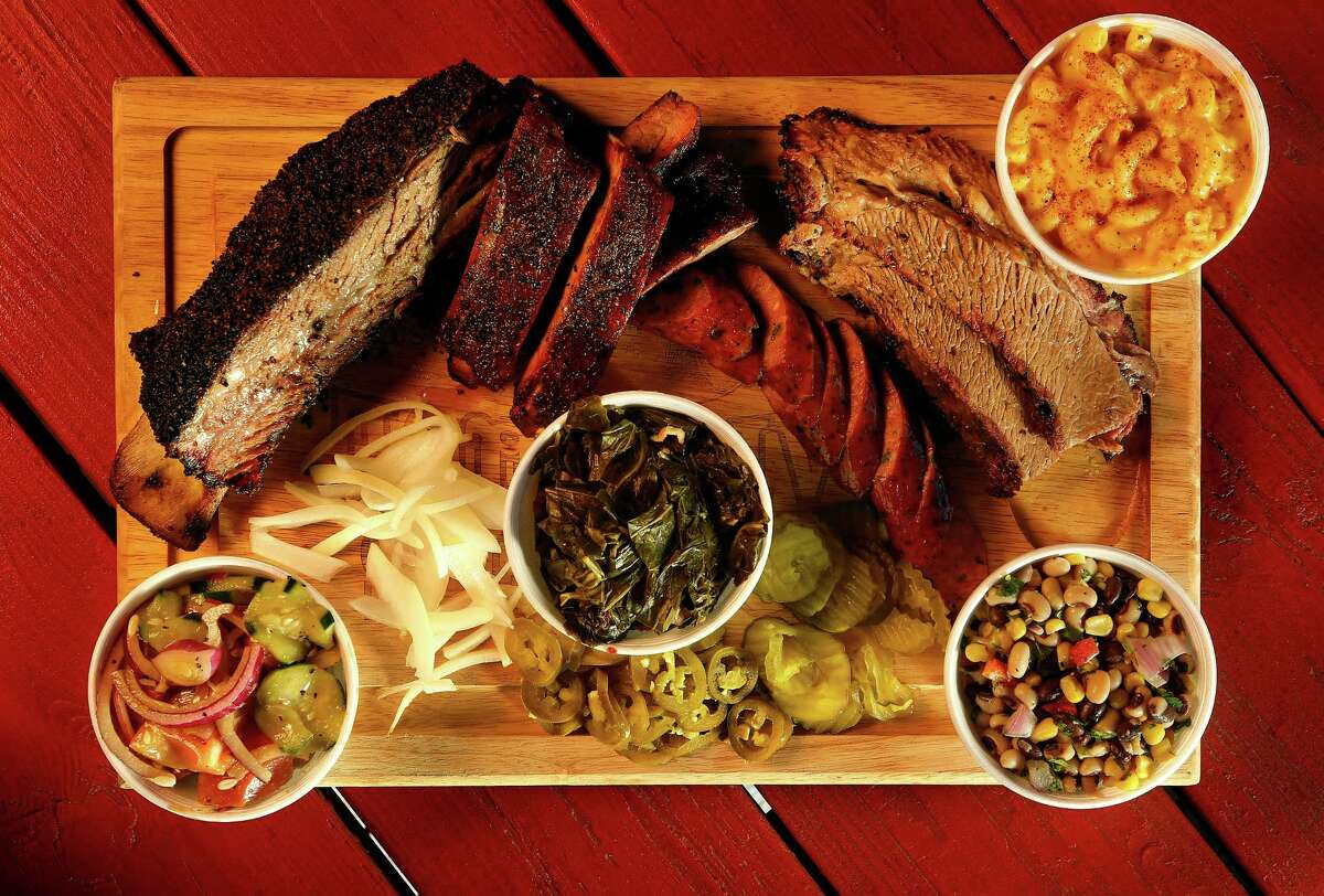 The sides refuse to take a backseat to the meat at Roegels Barbecue Co. on Voss Road, Wednesday, Feb. 17, 2016, in Houston. Tomatoes and cucumbers, collard greens, Texas caviar and mac and cheese surround the ribs, sausage and brisket. ( Mark Mulligan / Houston Chronicle )