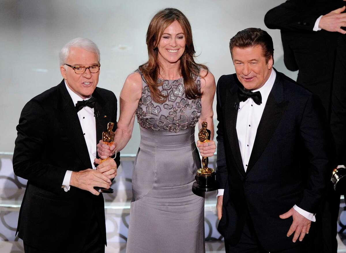 FILE - In this March 7, 2010 file photo, director Kathryn Bigelow, center, holds her Oscars for best motion picture of the year and best achievement in directing for "The Hurt Locker" with hosts Alec Baldwin, right, and Steve Martin at the conclusion of the 82nd Academy Awards in Los Angeles. Bigelow was the first and only woman to win an Oscar for best director. (AP Photo/Mark J. Terrill, File) ORG XMIT: NYET112