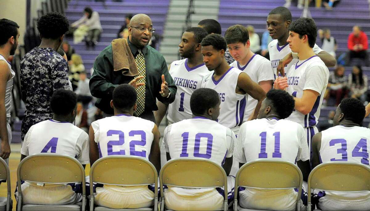 Westhill coach Howard White speaks with his players prior to the start of the second half of an FCIAC basketball game against Wilton on Monday, Feb. 22, 2016 at Westhill High School in Stamford. Wilton defeated Westhill 63-54.