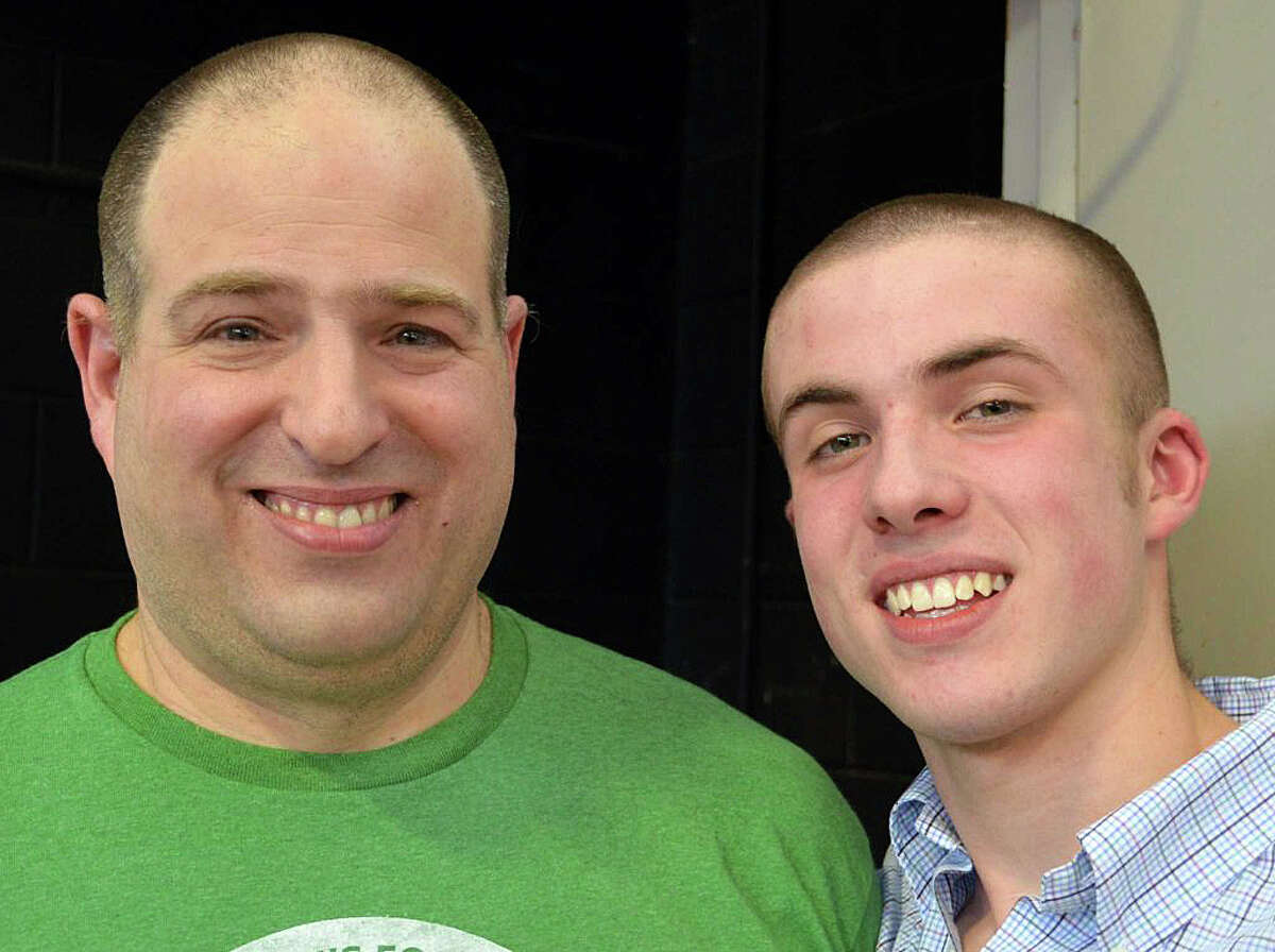Bill Gerber, left, and son John, 16 -- father and brother of the late Teddy Gerber -- after undergoing the clippers at the annual Team Teddy St. Baldrick's fundraiser at Osborn Hill School last year. This year's event is set for March 18.