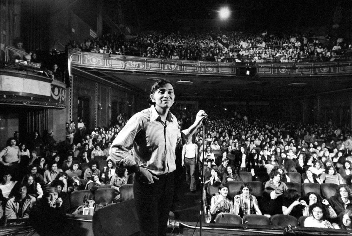 Rock promoter Bill Graham onstage before the final concert at Fillmore East, New York, January 1, 1971. Chromogenic print, The LIFE Picture Collection/Getty Images. Bill Graham and the Rock & Roll Revolution is organized and circulated by the Skirball Cultural Center, Los Angeles, California. On view March 17–July 5, 2016 at The Contemporary Jewish Museum, San Francisco. Rock promoter Bill Graham onstage w. audience visible, at Fillmore East. (Photo by John Olson/The LIFE Picture Collection/Getty Images)