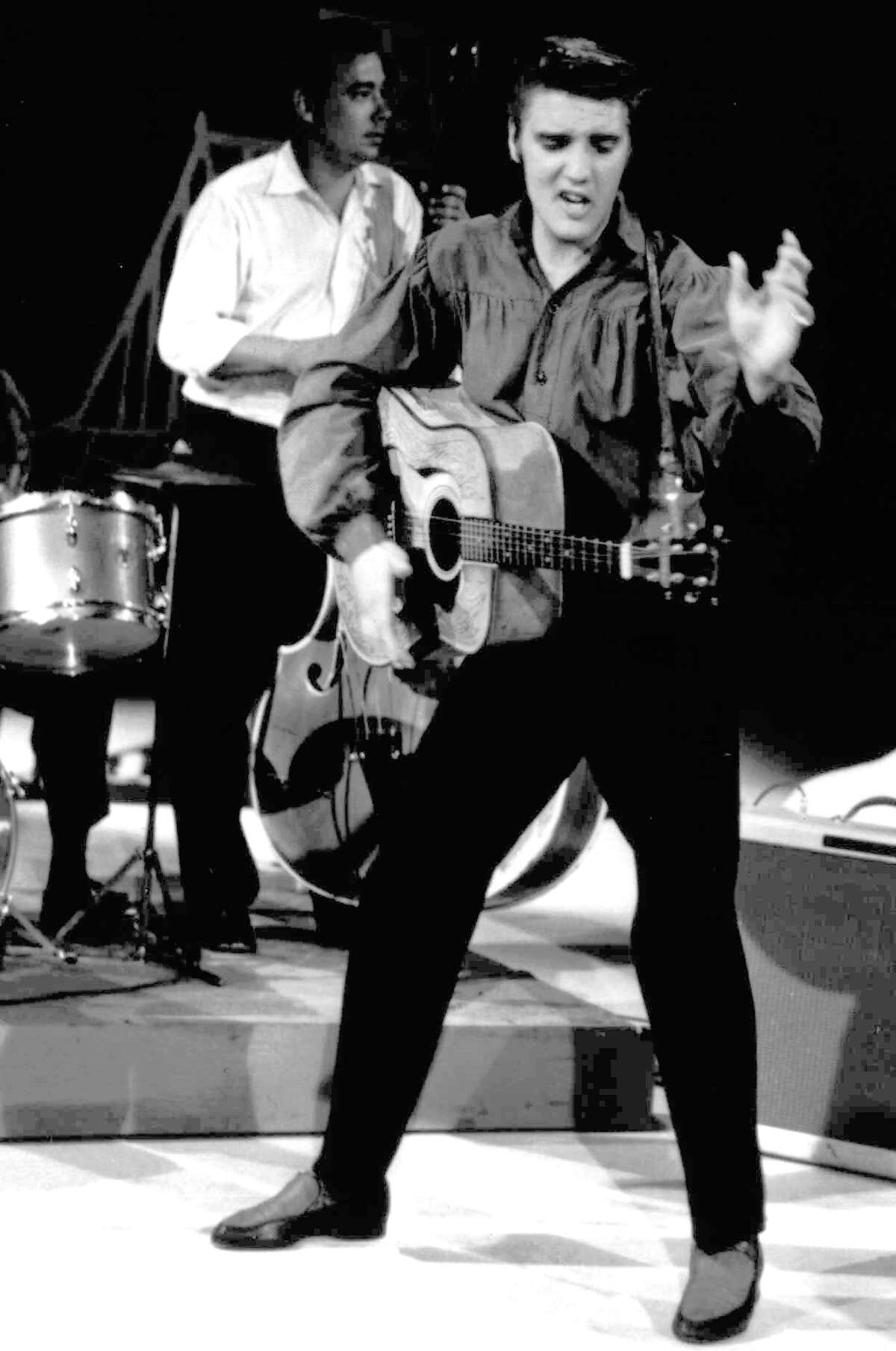 FILE - In this Sept. 9, 1956 file photo originally released by the Museum of Television & Radio, Elvis Presley performs on the "Ed Sullivan Show," in New York. (AP Photo/Museum of Television & Radio, file)