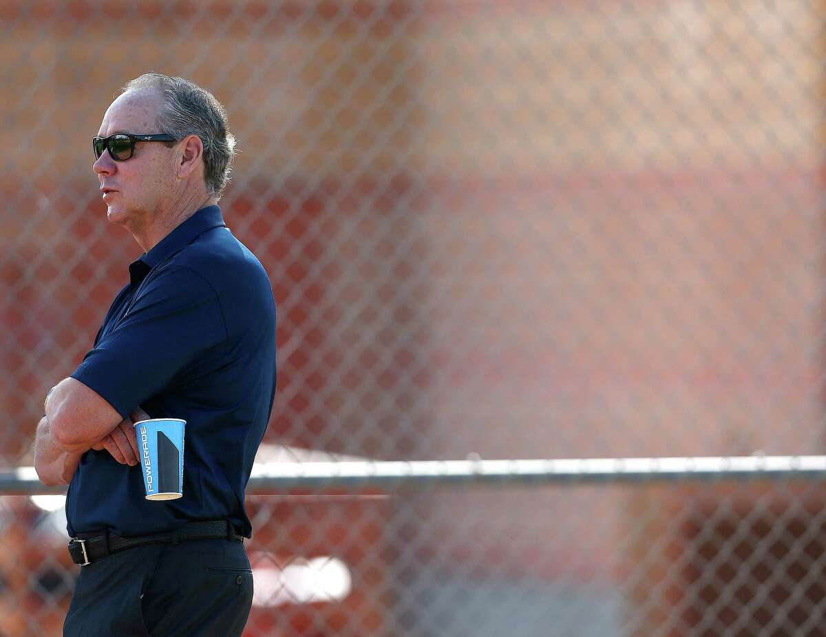 Houston Astros owner Jim Crane watches players during the first full-squad workouts at the Astros spring training in Kissimmee, Florida, Tuesday, Feb. 23, 2016.