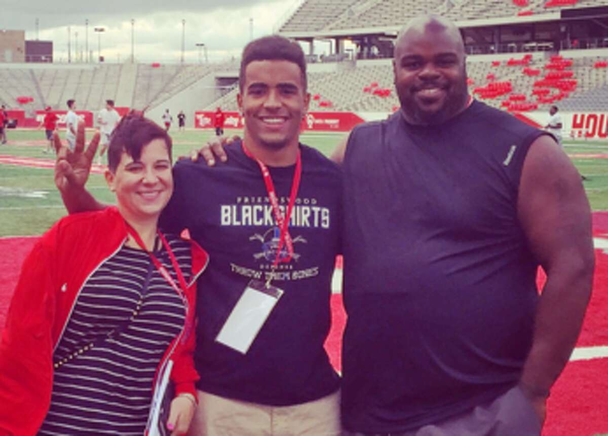 D'Aundre Holmes-Wilfork with his mother and father, Texans defensive tackle Vince Wilfork, in February 2016 after Holmes-Wilfork announced his transfer to UH as a preferred walk-on.