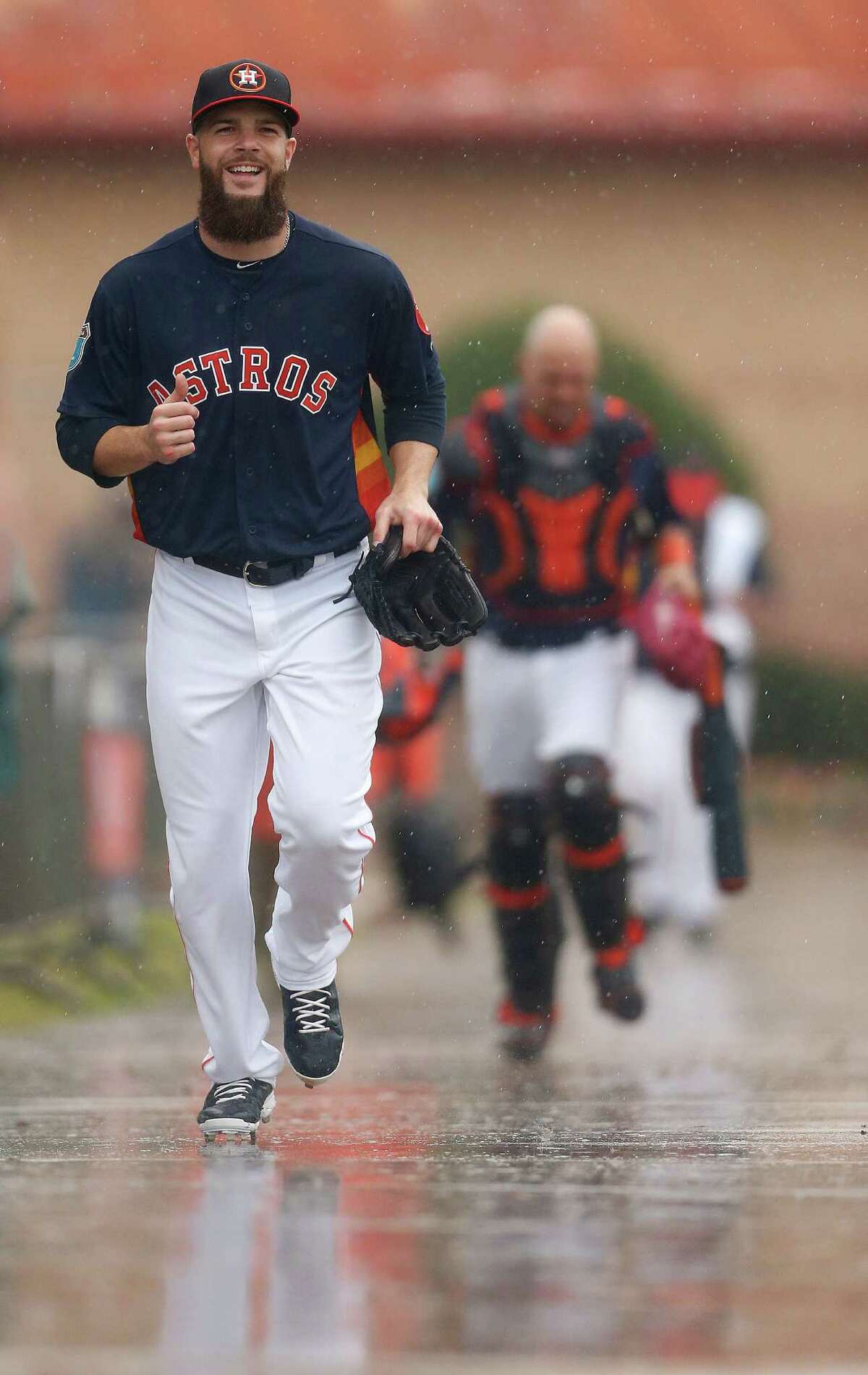 Houston Astros pitcher Dallas Keuchel runs to the batting cages as players worked out inside due to the rain during Astros spring training in Kissimmee, Florida, Wednesday, Feb. 24, 2016.