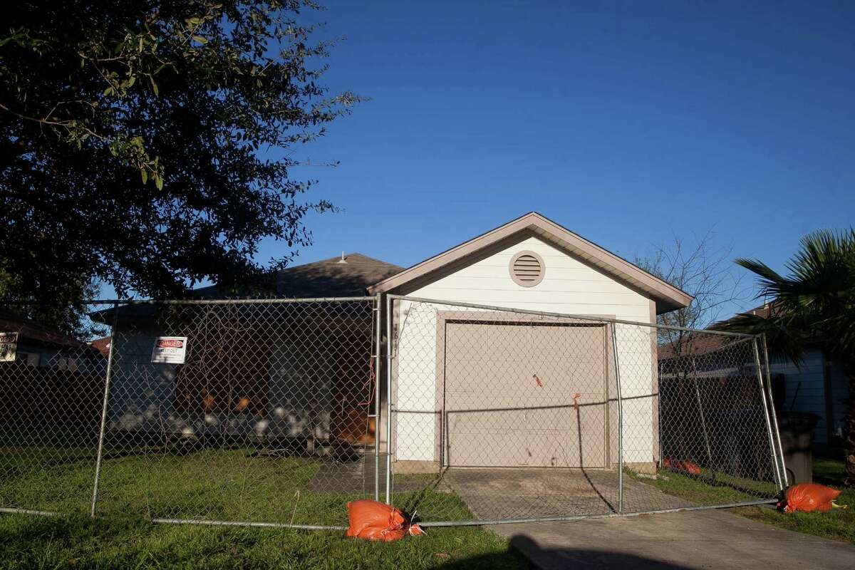 The first of the 39 Mirasol Homes to be demolished sits boarded up and fenced in Wednesday Feb.23, 2015 in the Blueridge neighborhood. The demolition arrives almost five years after the companies who built the houses settled with residents and the San Antonio Housing Authority for $20 million after residents said the homes were shoddily built.