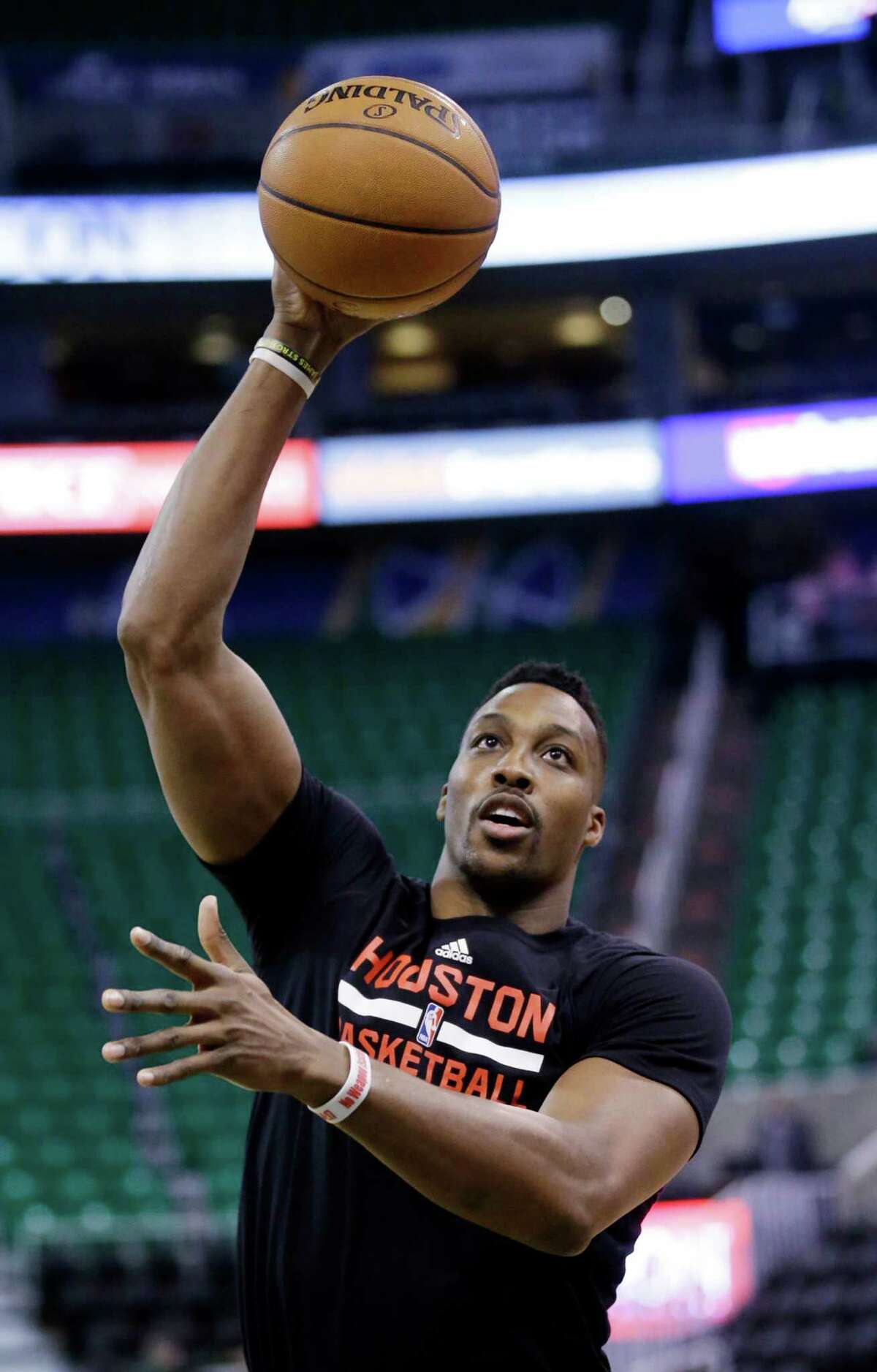 Houston Rockets center Dwight Howard shoots during practice before the start of their NBA basketball game against the Utah Jazz Tuesday, Feb. 23, 2016, in Salt Lake City. (AP Photo/Rick Bowmer)