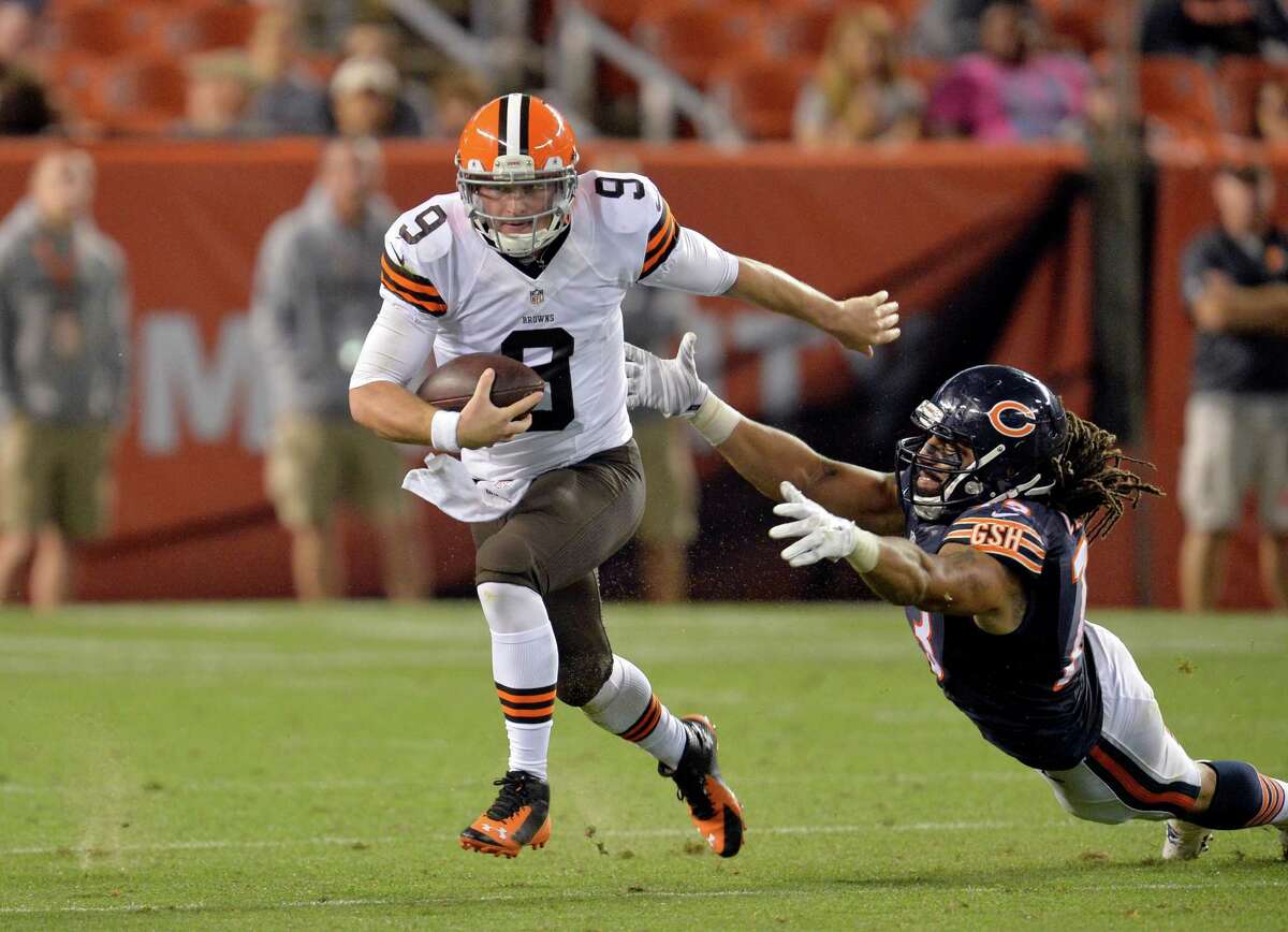 FILE - In this Aug. 28, 2014, file photo, Cleveland Browns quarterback Connor Shaw (9) runs away from Chicago Bears defensive end Austen Lane in the fourth quarter of a preseason NFL football game in Cleveland. With both Brian Hoyer and Johnny Manziel out with injuries, the rookie quarterback is expected to make his first NFL start Sunday against a Baltimore Ravens team fighting for a playoff spot. (AP Photo/David Richard, File)