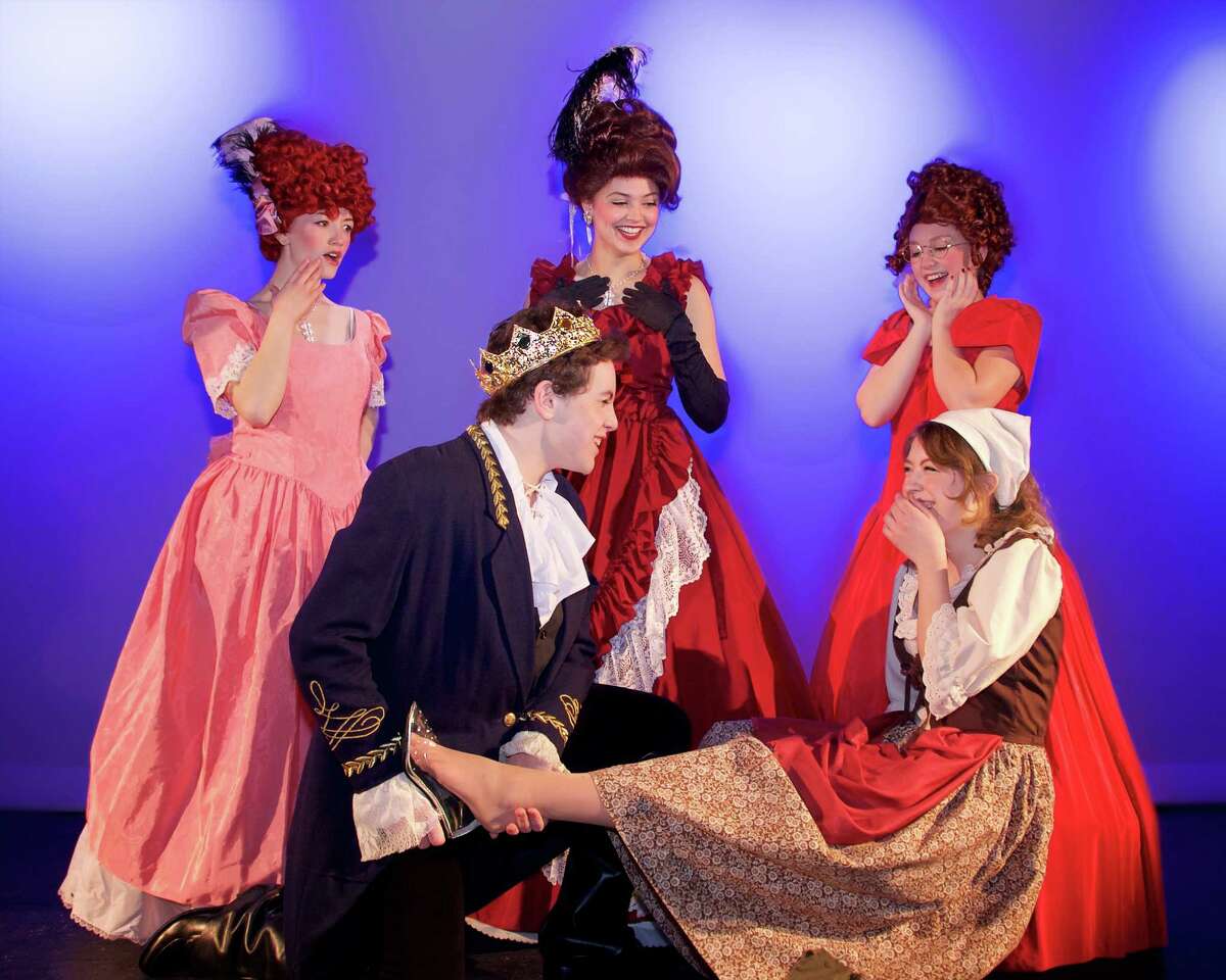 The New Milford High School all-school musical production of Rodgers and Hammersteins‘ "Cinderella" will be staged March 18-20 and April 1-2. Above, the prince, portrayed by Tony Harkin, tries the glass slipper on Cinderella, portrayed by Cassie Bielmeier, as, from left to right in back, Kay Mickelson as Charlotte, Anna Wright as the stepmother and Jordan Cowan as Gabrielle look on.