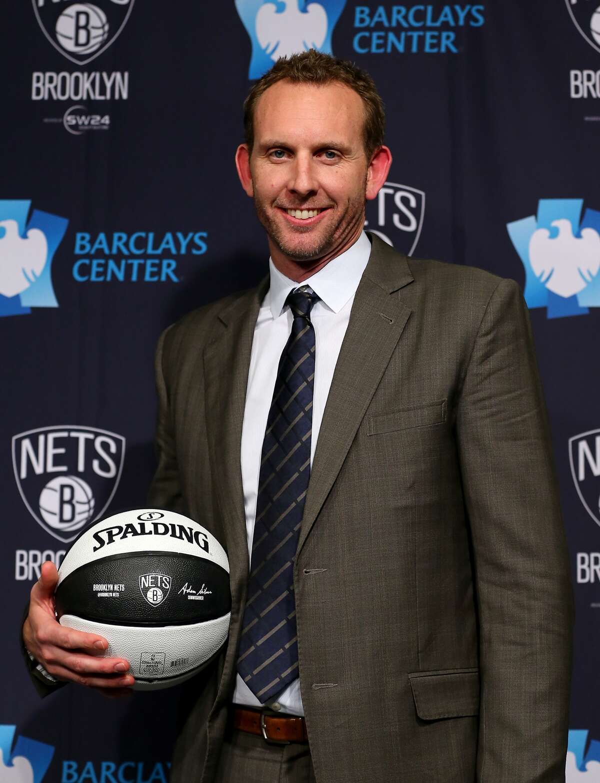 NEW YORK, NY - FEBRUARY 19: Sean Marks, General Manager of the Brooklyn Nets, poses with a ball after a press conference announcing title at Barclays Center on February 19, 2016 in the Brooklyn borough of New York City. NOTE TO USER: User expressly acknowledges and agrees that, by downloading and or using this photograph, User is consenting to the terms and conditions of the Getty Images License Agreement. (Photo by Elsa/Getty Images)