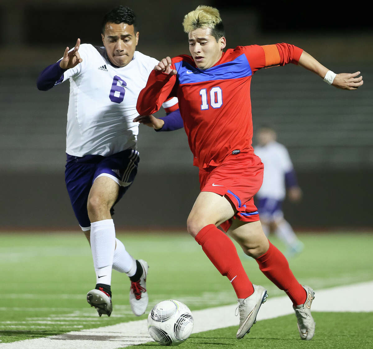 Jefferson’s John Mendoza (right) battles Brackenridge’s Oscar Vasquez for the ball during the first half of their District 28-5A game on Feb. 9.