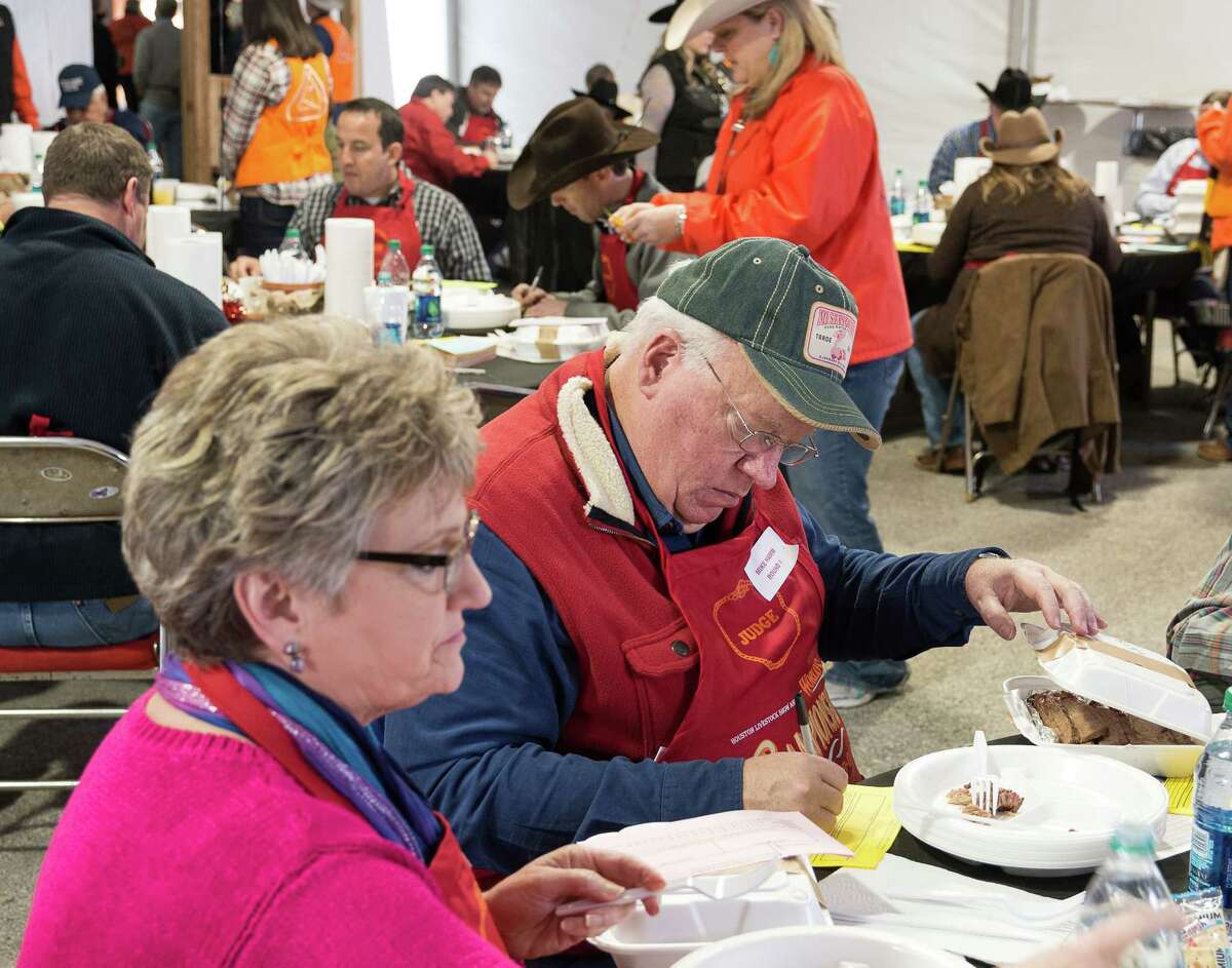 Cook-off judges evaluating barbecue samples at the World's Championship Bar-B-Que competition at the Houston Livestock Show and Rodeo in 2015.