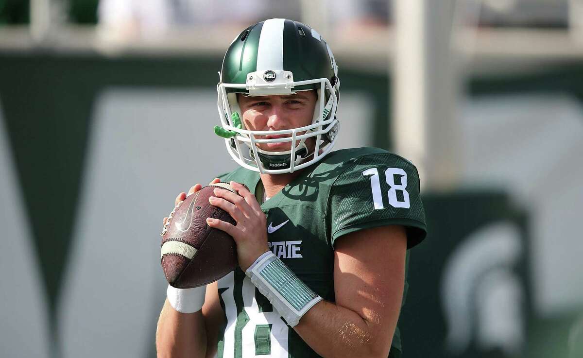 EAST LANSING MI - SEPTEMBER 26: Connor Cook #18 of the Michigan State Spartans warms up prior to the start of the game against the Central Michigan Chippewas on September 26, 2015 at Spartan Stadium in East Lansing, Michigan. (Photo by Leon Halip/Getty Images)
