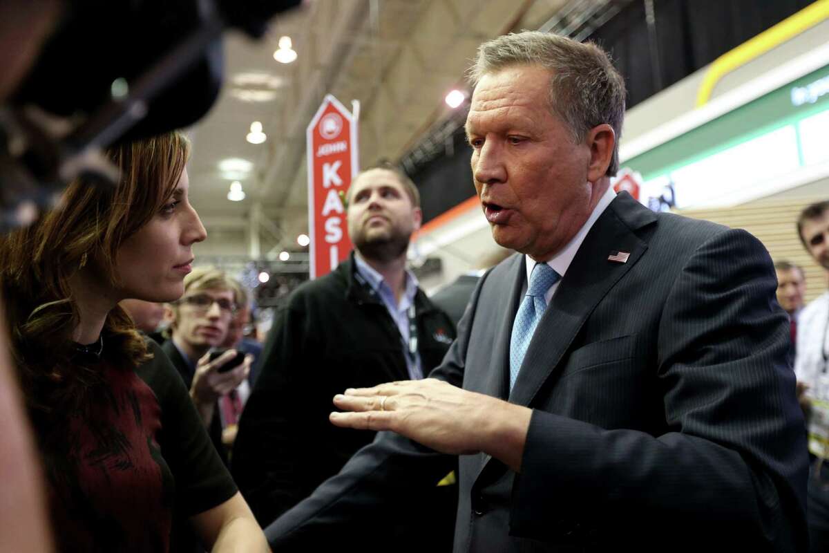 John Kasich addresses the media in the spin room after the Republican presidential primary debate at the University of Houston Thursday, Feb. 25, 2016, in Houston.