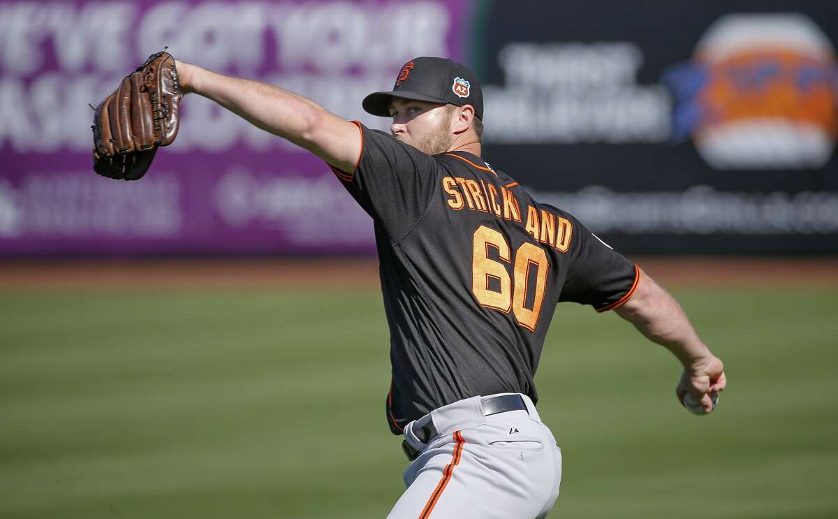 Pitcher Hunter Strickland, 60 throws during workouts at San Francisco Giants spring training as they prepare for the 2016 season, at Scottsdale Stadium on Friday February 26, 2016 in Scottsdale, Arizona.