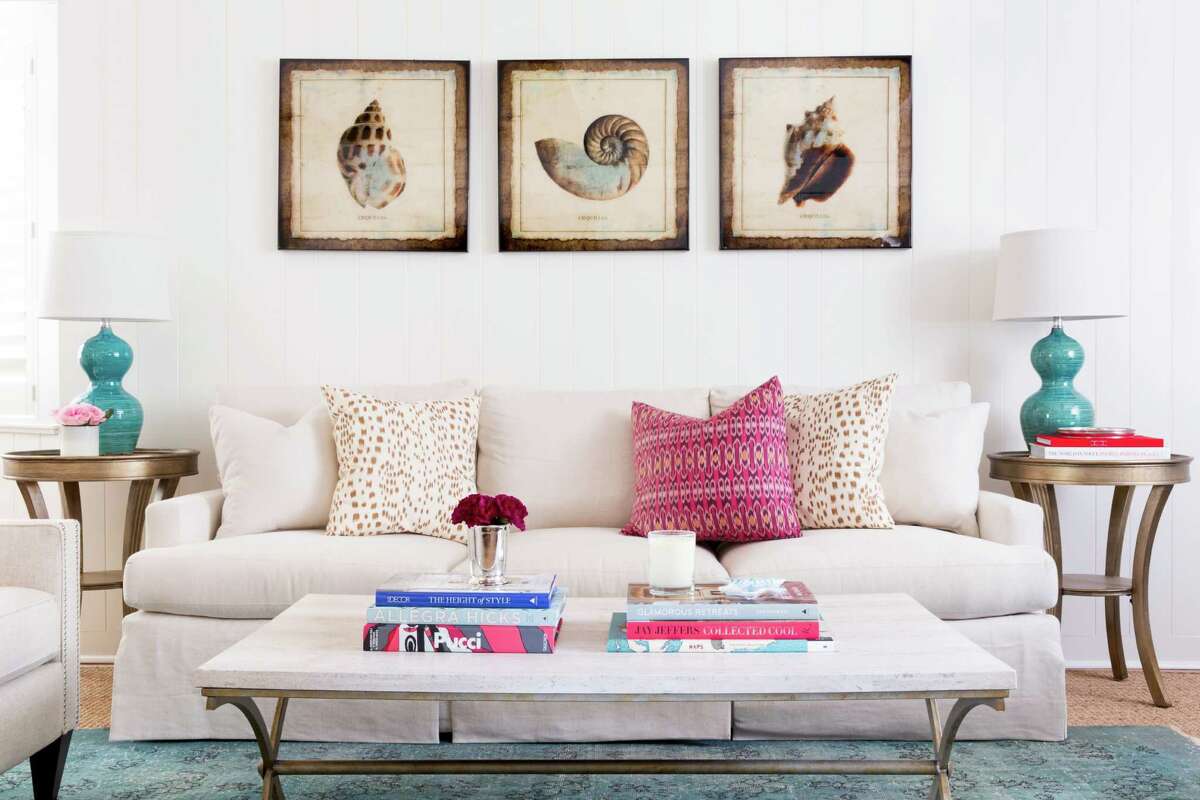 For the den, Jennifer Barron ordered a Lee Industries custom sofa; she made the bright pillows herself. The quartz coffee table came from High Fashion Home, and the matching lamps were an antiques store find.
