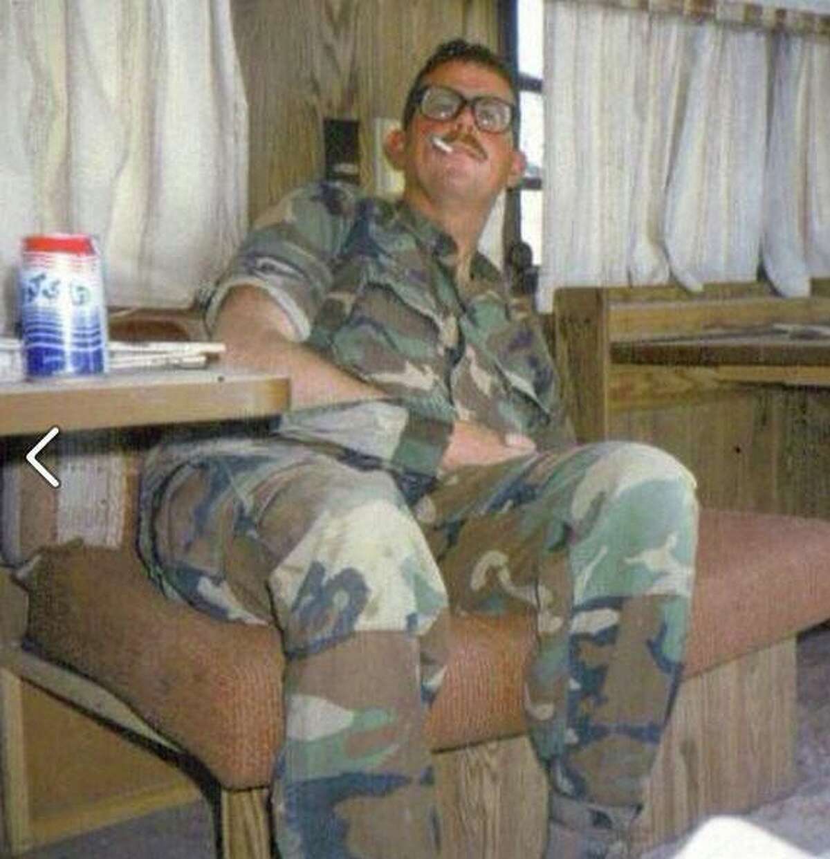 Mike Glenn: "A few minutes after our last gunfight. I'm sitting in a captured Iraqi Republican Guard trailer, smoking a cig and drinking from a can of Haji cola. Good times."