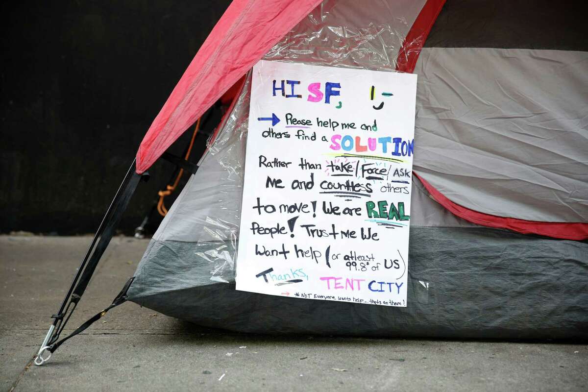 A sign attached to the side of a tent asks for help in finding a solution to the problem of homelessness on Thursday, February 25, 2016 in San Francisco, California.