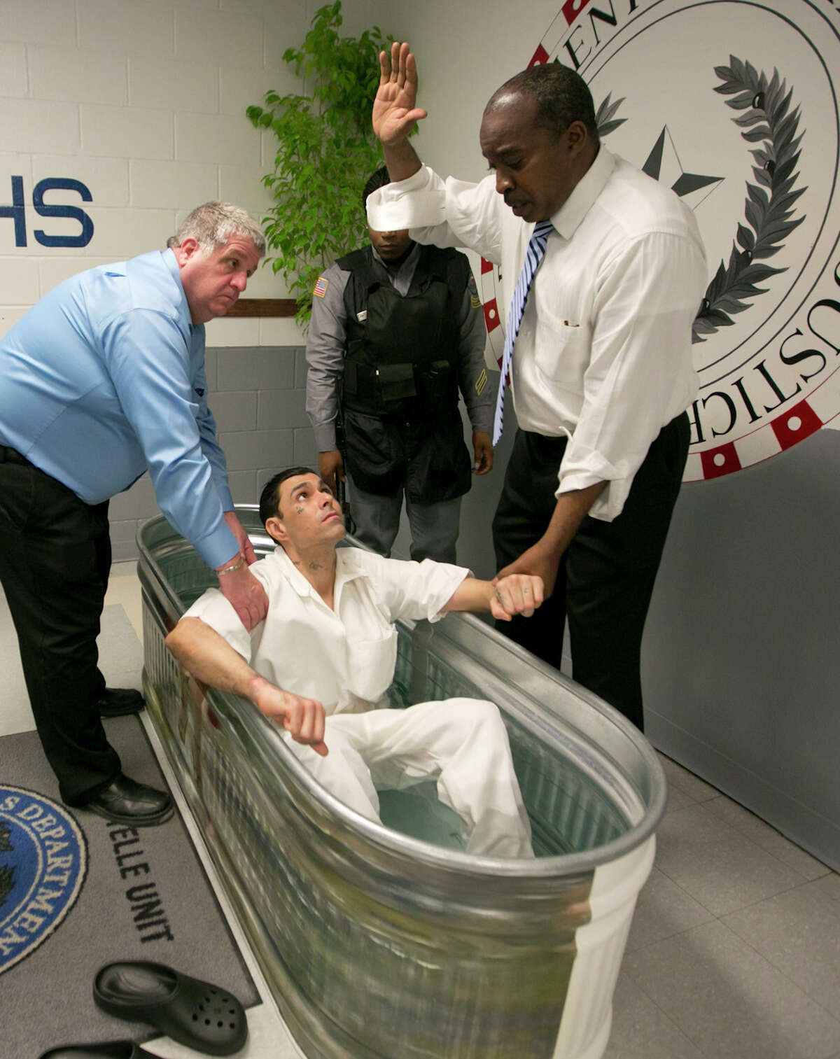 One of three prison inmates is baptized Friday at the Texas Department of Criminal Justice's Estelle High-Security Unit in Huntsville.