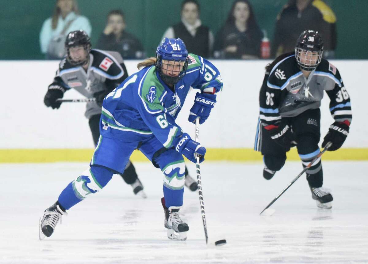 Connecticut Whale's Kelli Stack (61) skates up the ice during the National Women's Hockey League game between the Connecticut Whale and the Buffalo Beauts at Chelsea Piers in Stamford, Conn. Sunday, Jan. 10, 2016. The Stamford-based Whale is one of the four charter franchises of the new National Women's Hockey League (NWHL).