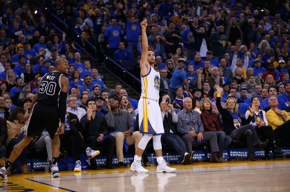 OAKLAND, CA - JANUARY 25: Stephen Curry #30 of the Golden State Warriors watches a three-point basket go in against the San Antonio Spurs at ORACLE Arena on January 25, 2016 in Oakland, California. NOTE TO USER: User expressly acknowledges and agrees that, by downloading and or using this photograph, User is consenting to the terms and conditions of the Getty Images License Agreement. (Photo by Ezra Shaw/Getty Images)