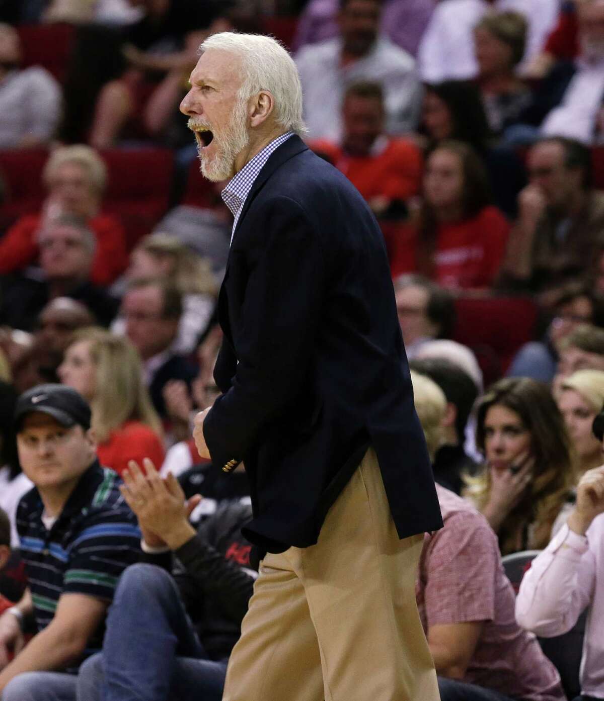San Antonio Spours coach Gregg Popovich yells to the officials during the first half of the team's NBA basketball game against the Houston Rockets on Saturday, Feb. 27, 2016, in Houston. (AP Photo/Bob Levey)