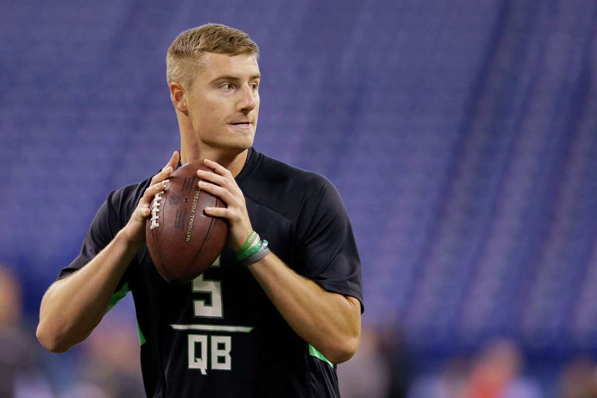 Michigan State quarterback Connor Cook runs a drill at the NFL football scouting combine in Indianapolis, Saturday, Feb. 27, 2016. (AP Photo/Michael Conroy)