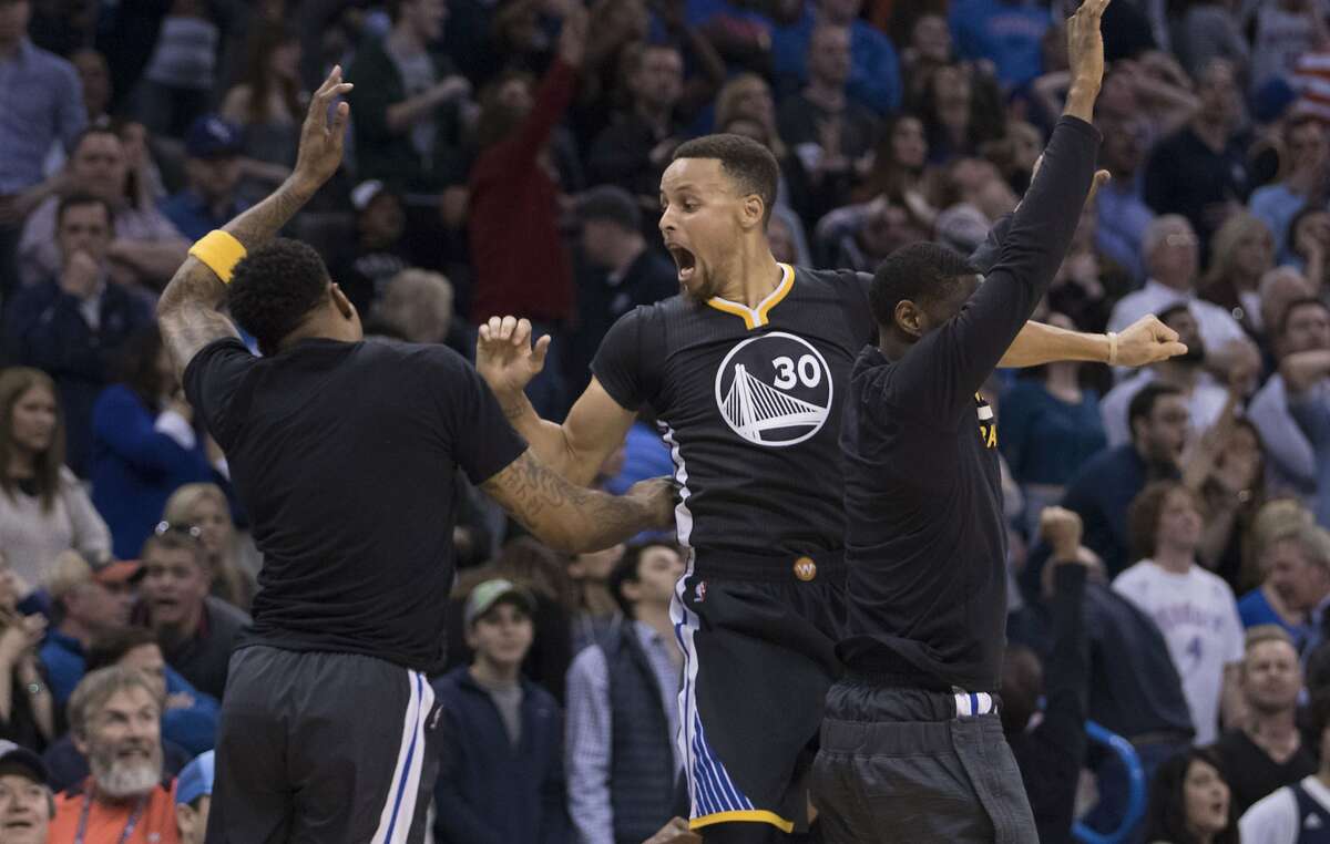 OKLAHOMA CITY, OK - FEBRUARY 27: After scoring the winning three-point shot Stephen Curry #30 of the Golden State Warriors celebrates during the overtime period of a NBA game against the Oklahoma City Thunder at the Chesapeake Energy Arena on February 27, 2016 in Oklahoma City, Oklahoma. The Warriors won 121-118 in overtime. NOTE TO USER: User expressly acknowledges and agrees that, by downloading and or using this photograph, User is consenting to the terms and conditions of the Getty Images License Agreement. (Photo by J Pat Carter/Getty Images)