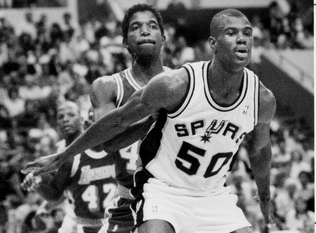 David Robinson goes up against the Lakers’ A.C. Green during his first game with the Spurs on Nov. 4, 1989, at HemisFair Arena.