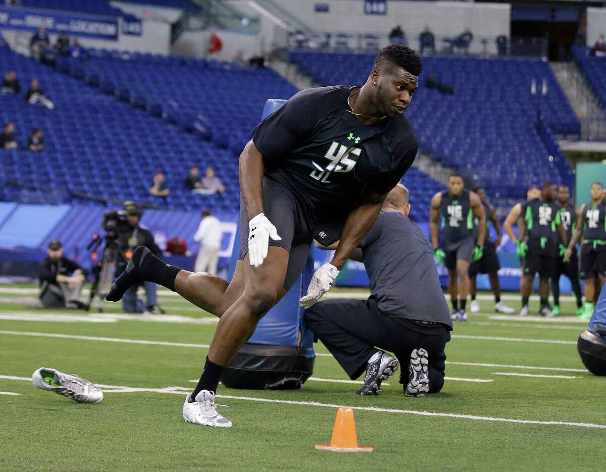 Oklahoma State defensive lineman Emmanuel Ogbah runs a drill at the NFL football scouting combine on Sunday, Feb. 28, 2016, in Indianapolis. (AP Photo/Darron Cummings)