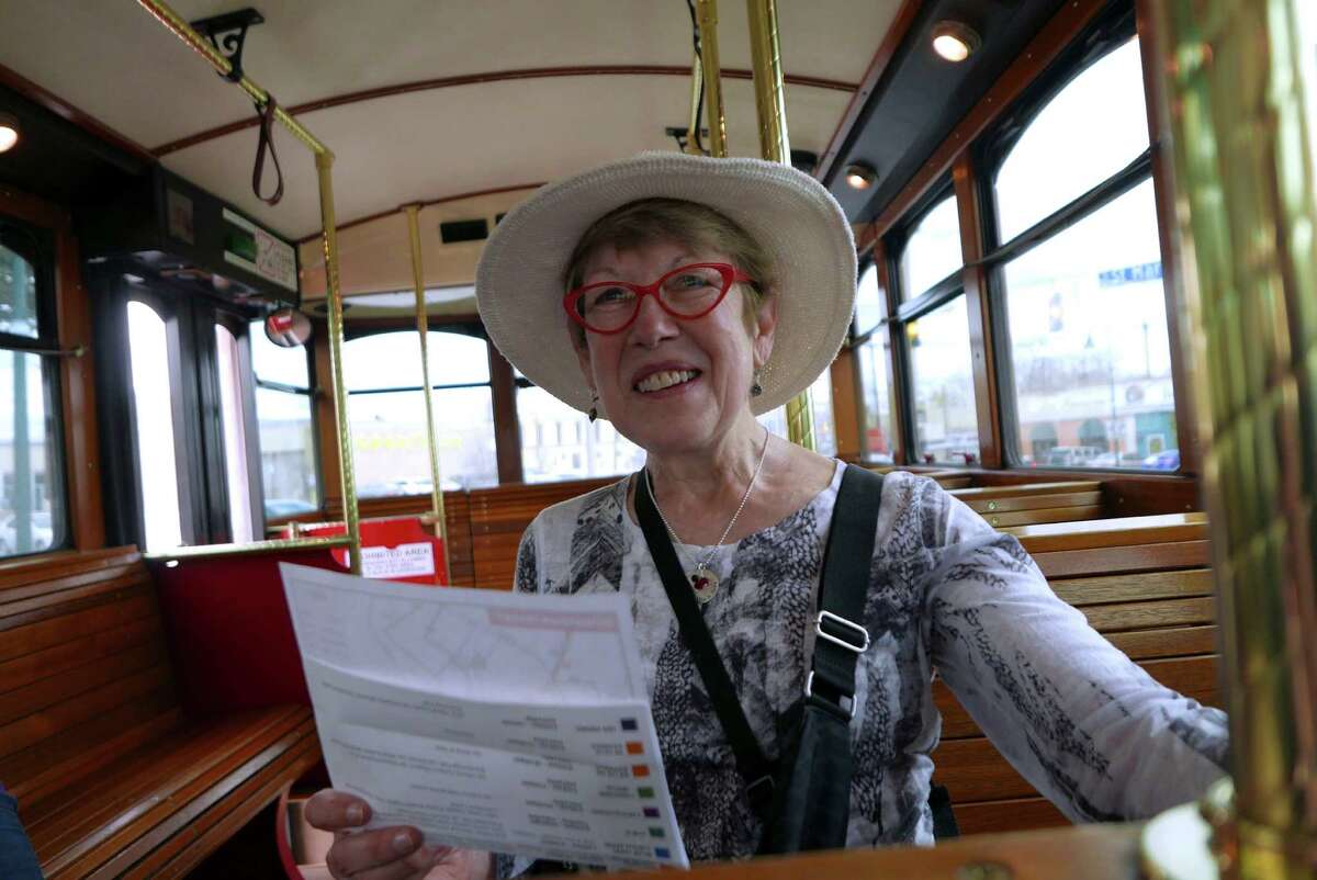 Kay Shannon of Evanston, Ill., reads a route map on the Blue Route rubber-wheeled trolley on Tuesday, Feb. 23, 2016. VIA is planning to consolidate the Blue Route, the E Route and the Sightseer Route in June. The new route will connect Southtown, the Pearl and the Museum Reach, a somewhat similar idea to the Holiday Special on the Blue Route.