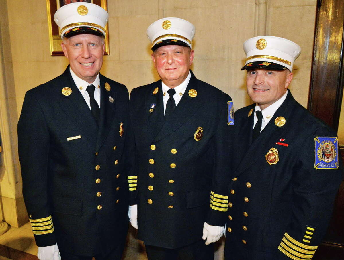 Albany firefighters from left, Executive Deputy Chief of the Department of Fire & Emergency Services Joseph J. Toomey, Deputy Chief Captain Joseph Gregory and Lieutenant Edmund J. Seney during a promotion ceremony Friday Oct. 3, 2014, in Albany, NY. (John Carl D'Annibale / Times Union)