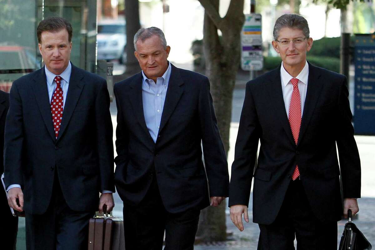 Robert Kaluza, a well site manager for BP during the 2010 explosion on board the Deepwater Horizon oil rig, center, arrives at federal court with his attorneys Shaun Clarke, left, and David Gerger, right, on in New Orleans, Louisiana, U.S., on Wednesday, Nov. 28, 2012..( Photographer: Derick E. Hingle/Bloomberg)