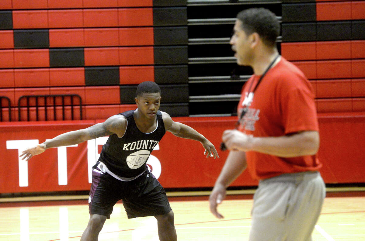 Senior starter Grayland Arnold takes up a defensive position as Coach Duane Joubert leads the Kountze Lions in a final practice before facing Crockett in their regional quarterfinal match-up Tuesday. Arnold is a driving force behind the Lions and hopes to lead the team back to the state tournament. Photo taken Monday, February 29, 2016 Kim Brent/The Enterprise