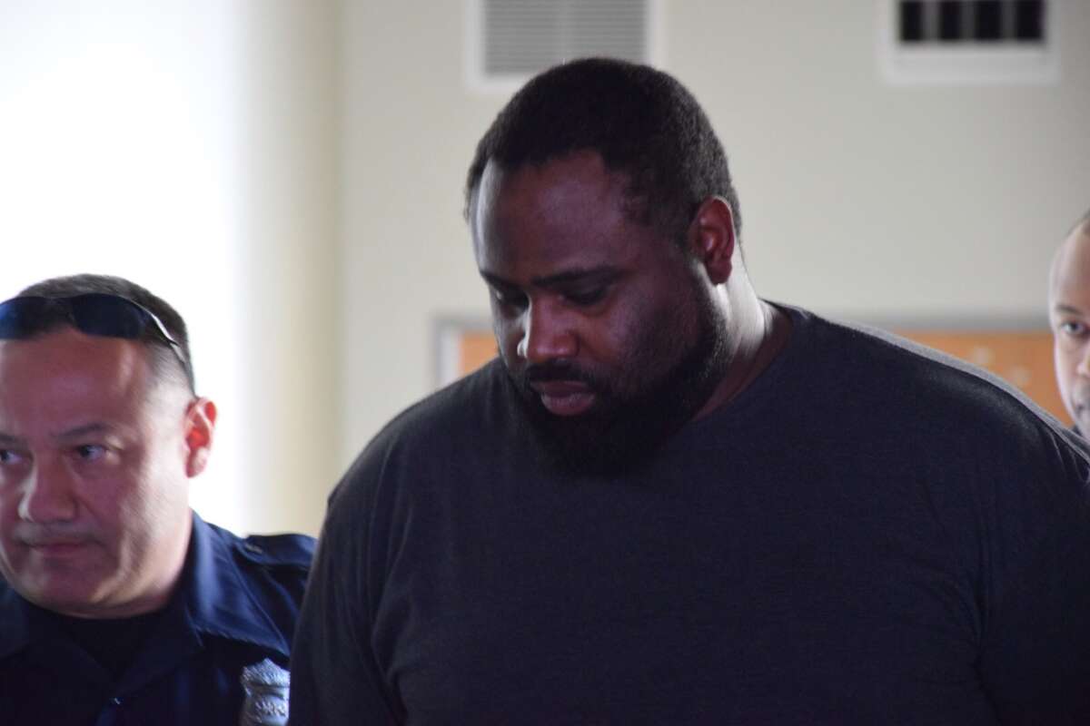 Police arrest and transport R.C. Curtis on March 1, 2016. Curtis is suspected of killing and robbing Paula Boyd, 75, in 2015.