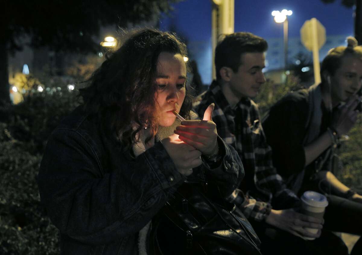 Natalie Richards, 19, smokes a cigarette in a Designated Smoking Area at San Francisco State University as supervisors consider a plan to raise the purchasing age for tobacco products to 21 in San Francisco, Calif., on Monday, February 29, 2016.