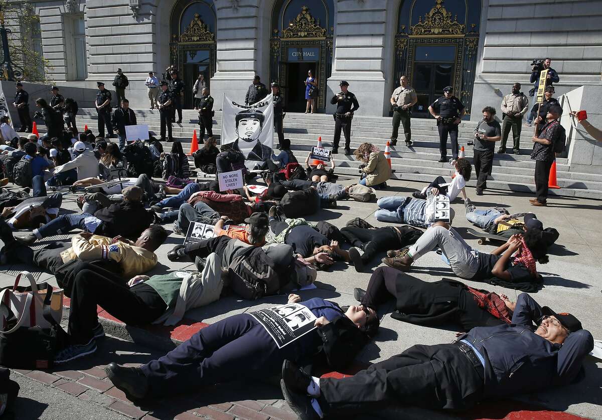 Protesters demanding justice for Alex Nieto stage a die-in in front of City Hall in San Francisco, Calif. on Tuesday, March 1, 2016. Jury selection and opening arguments were scheduled to get underway Tuesday in a federal civil rights trial against four police officers who shot and killed Alex Nieto in Bernal Heights Park nearly two years ago.
