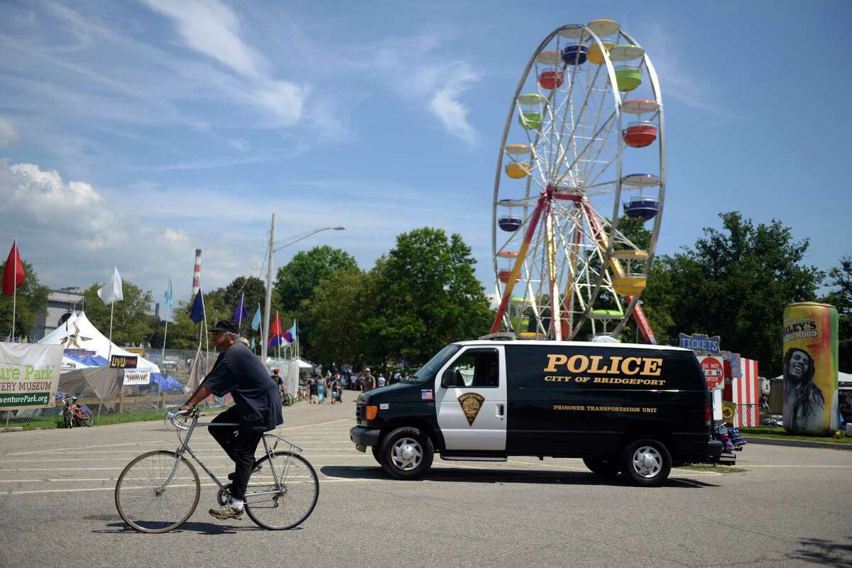 Police patrol the grounds at the annual Gathering of the Vibes musical festival at Seaside Park in Bridgeport in 2013.