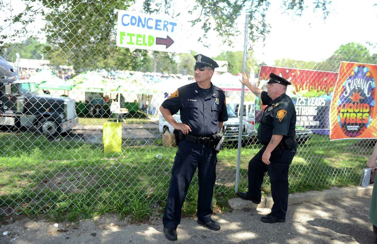 Police patrol the grounds at the annual Gathering of the Vibes musical festival at Seaside Park in Bridgeport, Conn. in 2013. The city of Bridgeport claims that Vibes organizers have failed to pay police overtime costs for the past three years, totaling over $750,000.