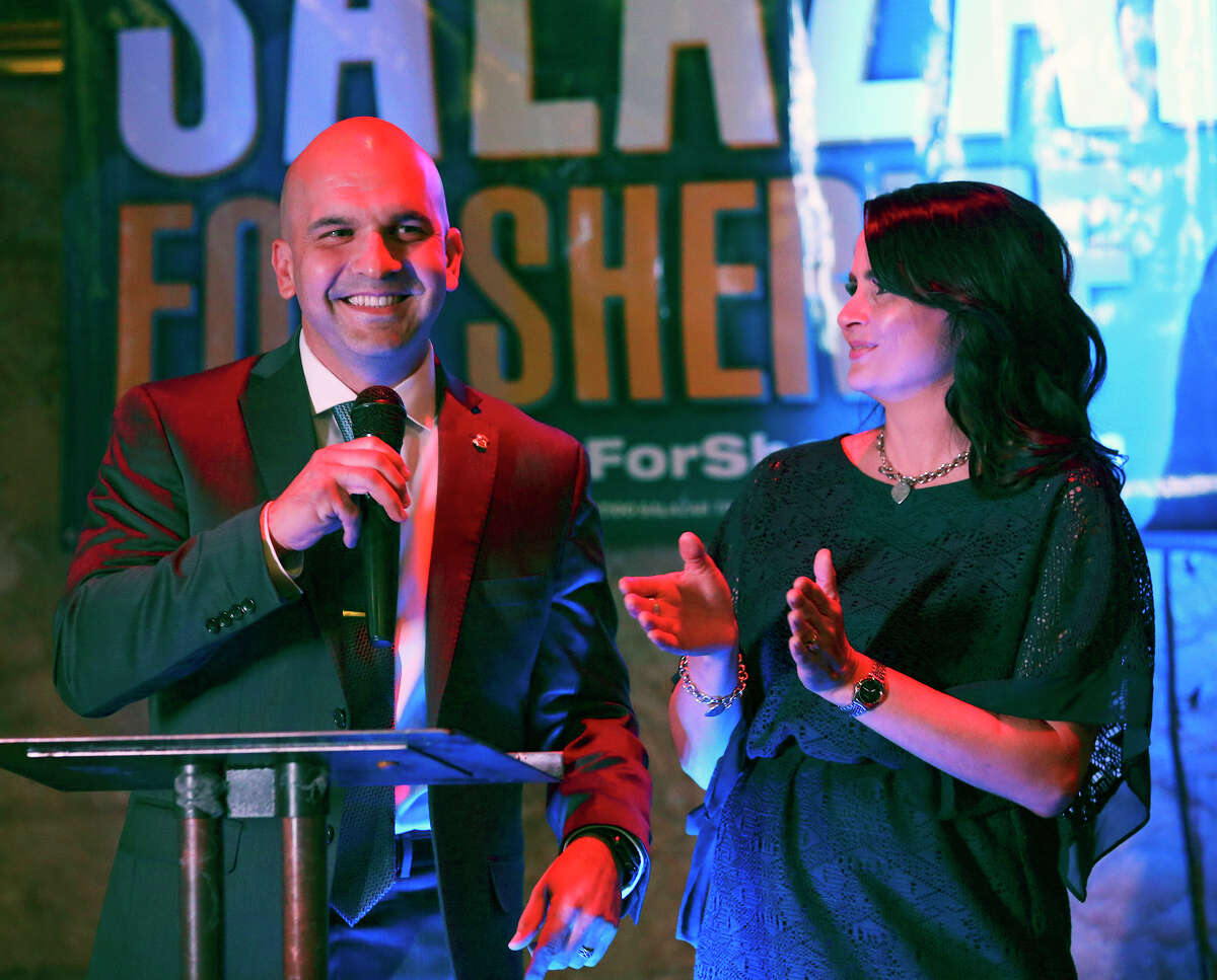 A lead in the early voting is celebrated as Javier Salazar, Democratic candidate for sheriff, holds his election night party at the Cadillac Bar on March 1, 2016. Sarah Salazar applauds the announcement.