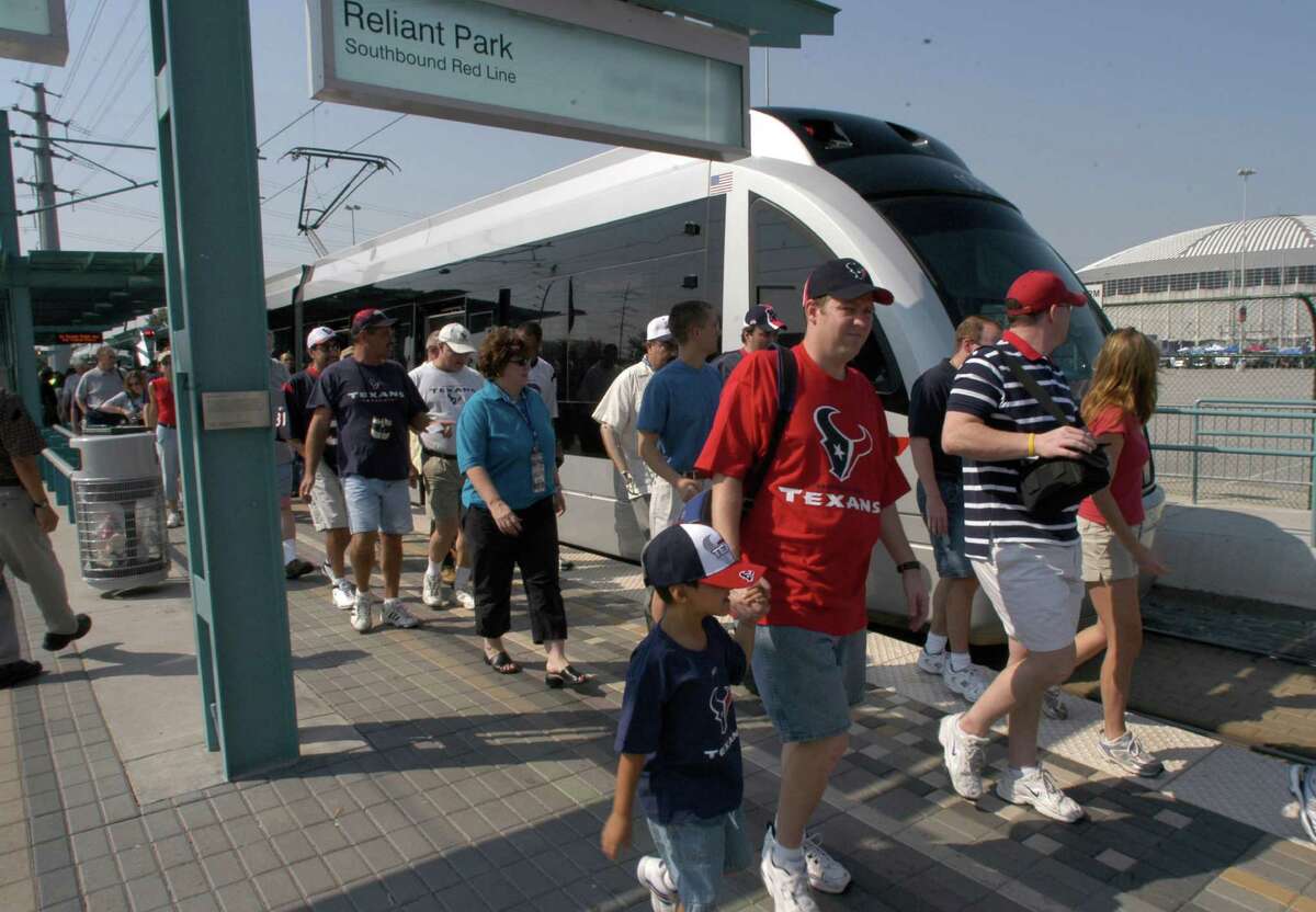 Passengers unload at Metro's Reliant Stadium stop for a Houston Texans game in 2005.