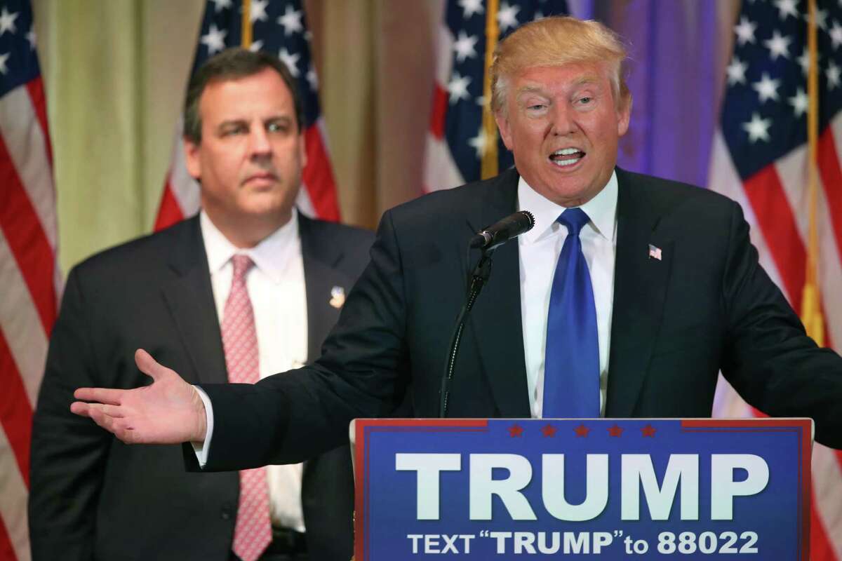 Republican presidential candidate Donald Trump speaks on Super Tuesday primary election night at the White and Gold Ballroom at The Mar-A-Lago Club in Palm Beach, Fla., Tuesday, March 1, 2016, as New Jersey Gov. Chris Christie listens. (AP Photo/Andrew Harnik)