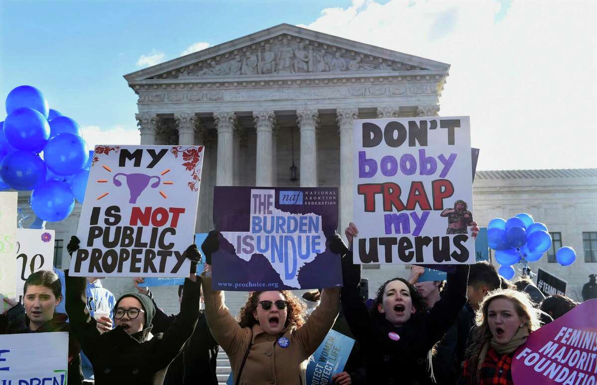 Pro-abortion rights protesters rally outside the Supreme Court in Washington, Wednesday, March 2, 2016. The abortion debate is returning to the Supreme Court in the midst of a raucous presidential campaign and less than three weeks after Justice Antonin Scalia’s death. The justices are taking up the biggest case on the topic in nearly a quarter century and considering whether a Texas law that regulates abortion clinics hampers a woman’s constitutional right to obtain an abortion. (AP Photo/Susan Walsh)